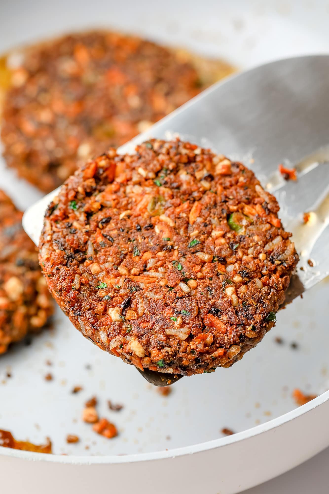 close up on a veggie burger on a spatula.