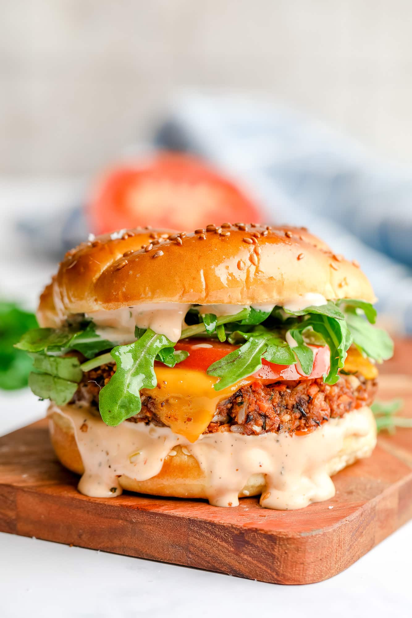 a veggie burger on a wood board.