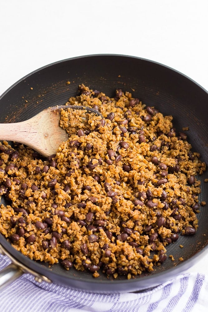 bean vegetable mixture for vegan enchiladas in a pan