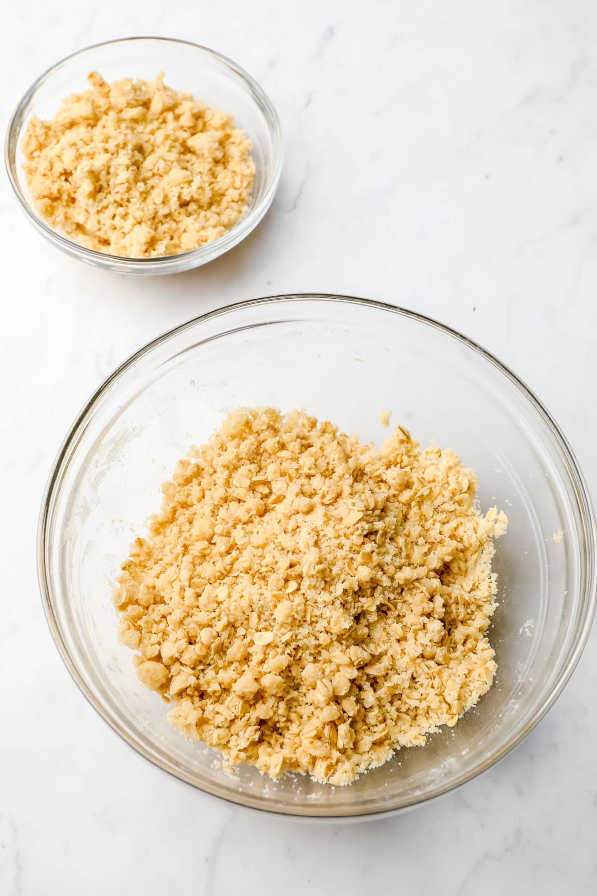 two bowls, one larger than the other with crumble topping