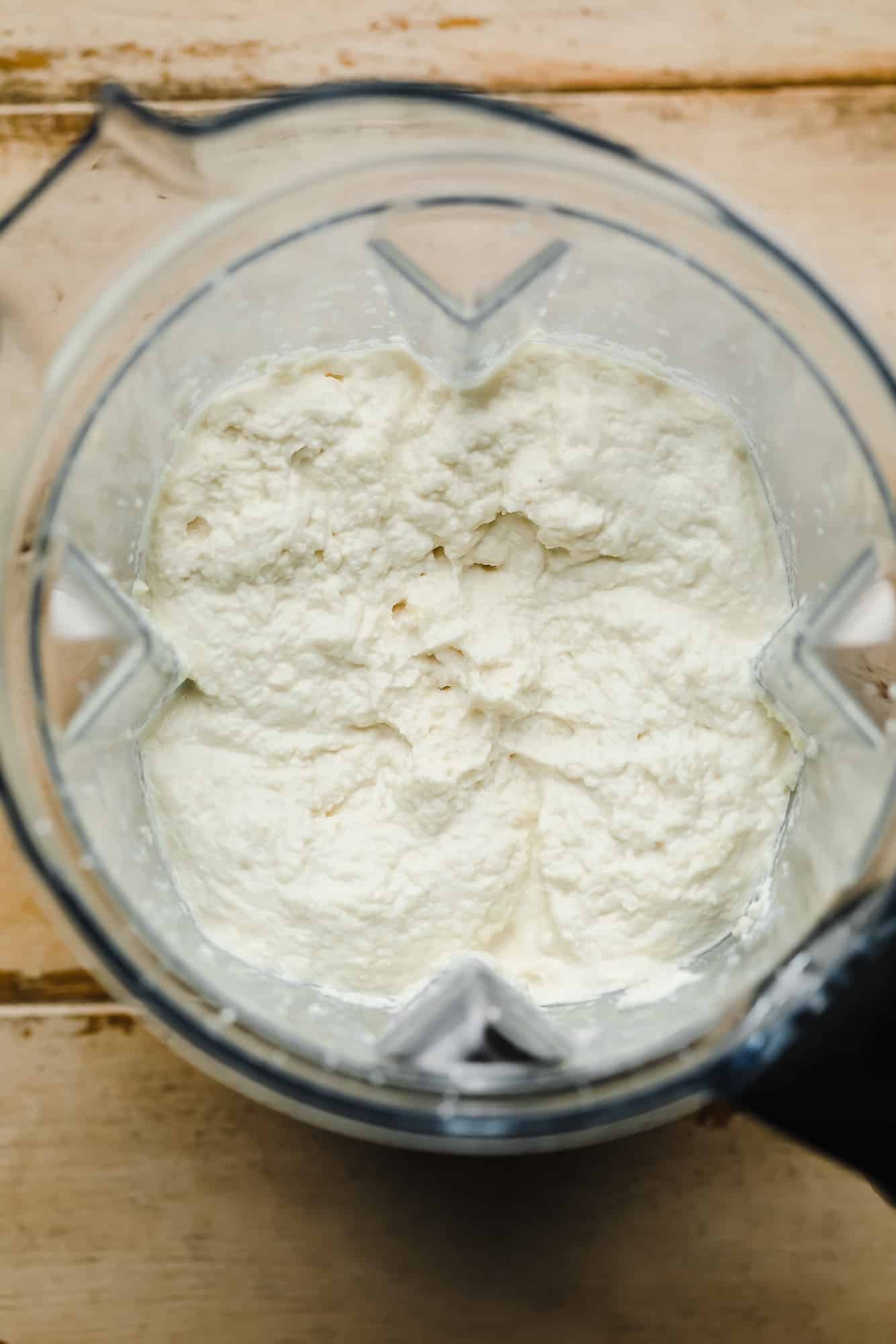 Blended vegan ricotta cheese in a blender.