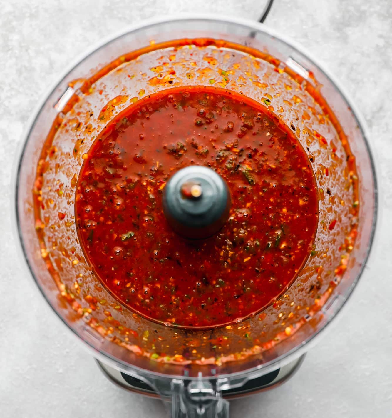 a blended red chili sauce in a food processor.