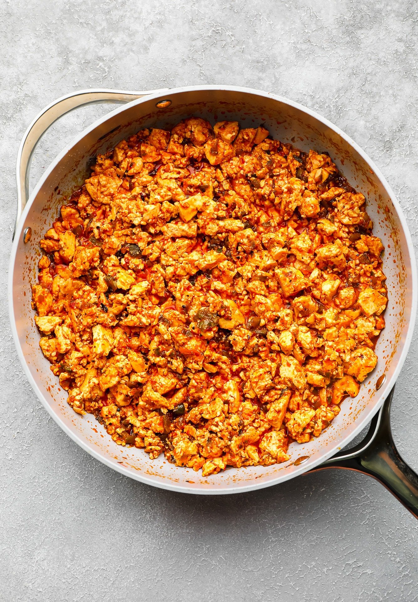 a batch of sofritas cooking in a large skillet.