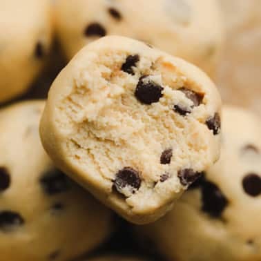 square image of a ball of cookie dough with a bite taken out of it