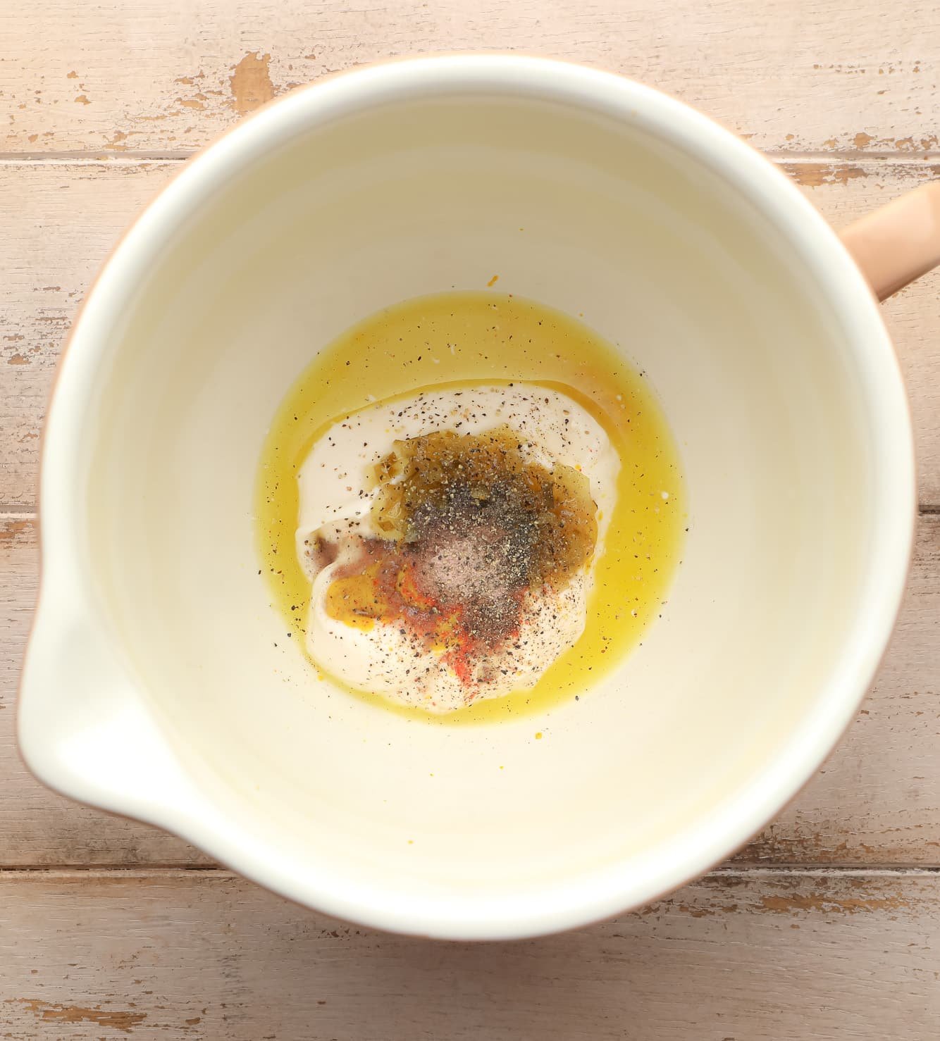 ingredients for tofu egg salad dressing in a large white bowl