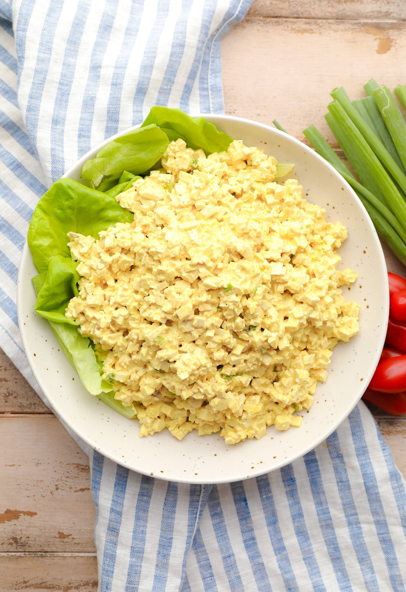 a large batch of vegan egg salad on a large white plate.
