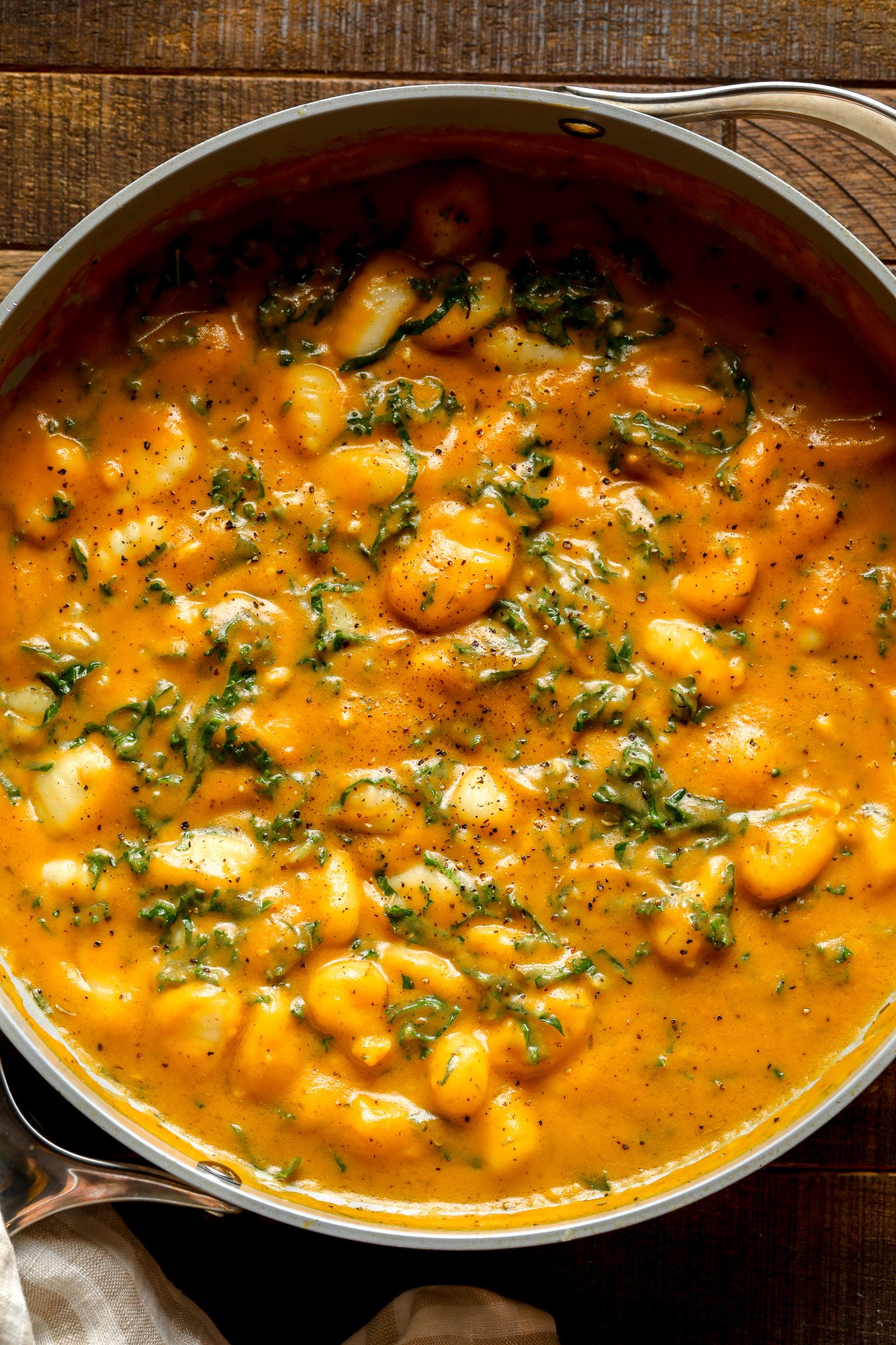 close up on a pot of cooked pumpkin gnocchi.