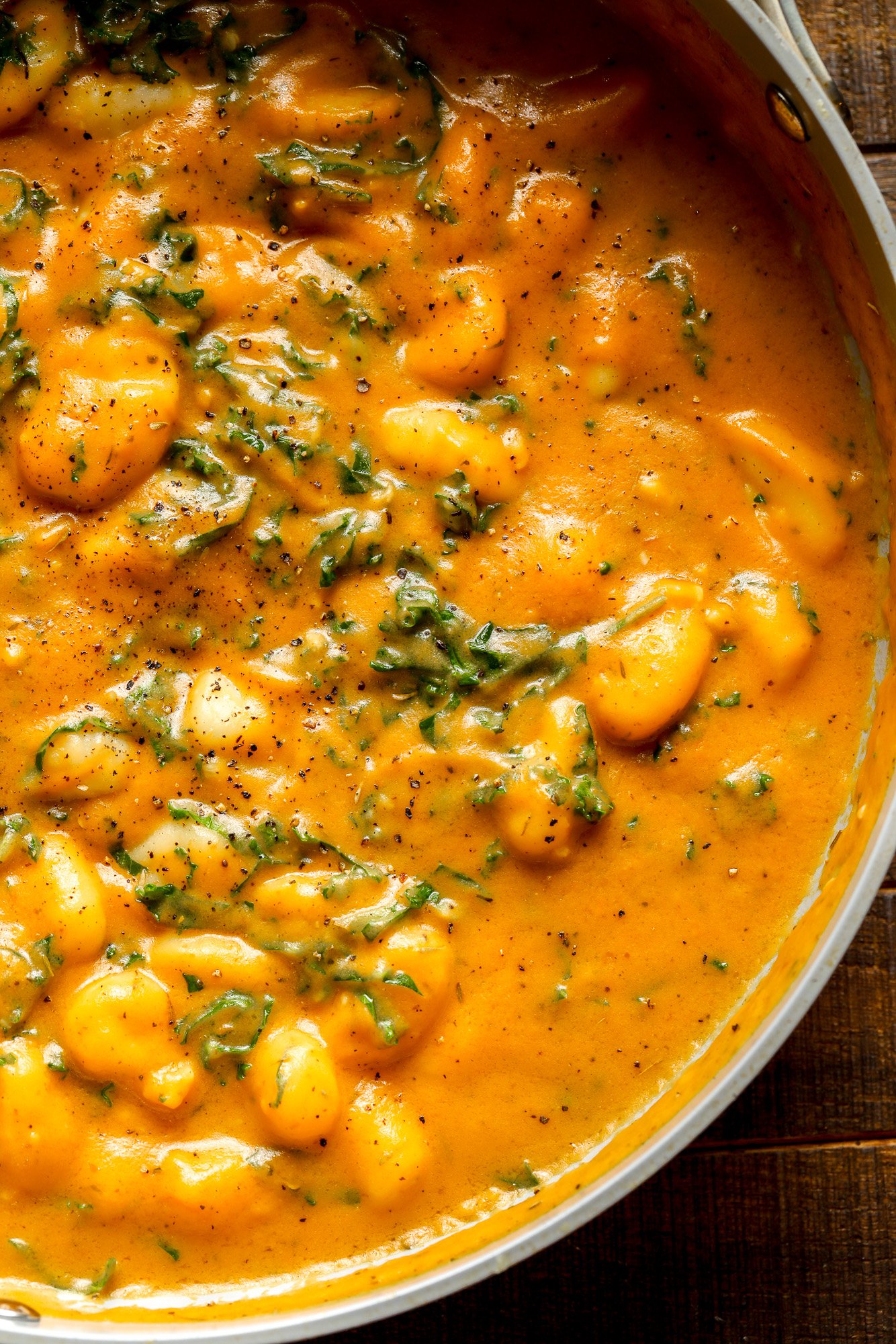 close up on a pot of cooked pumpkin gnocchi.