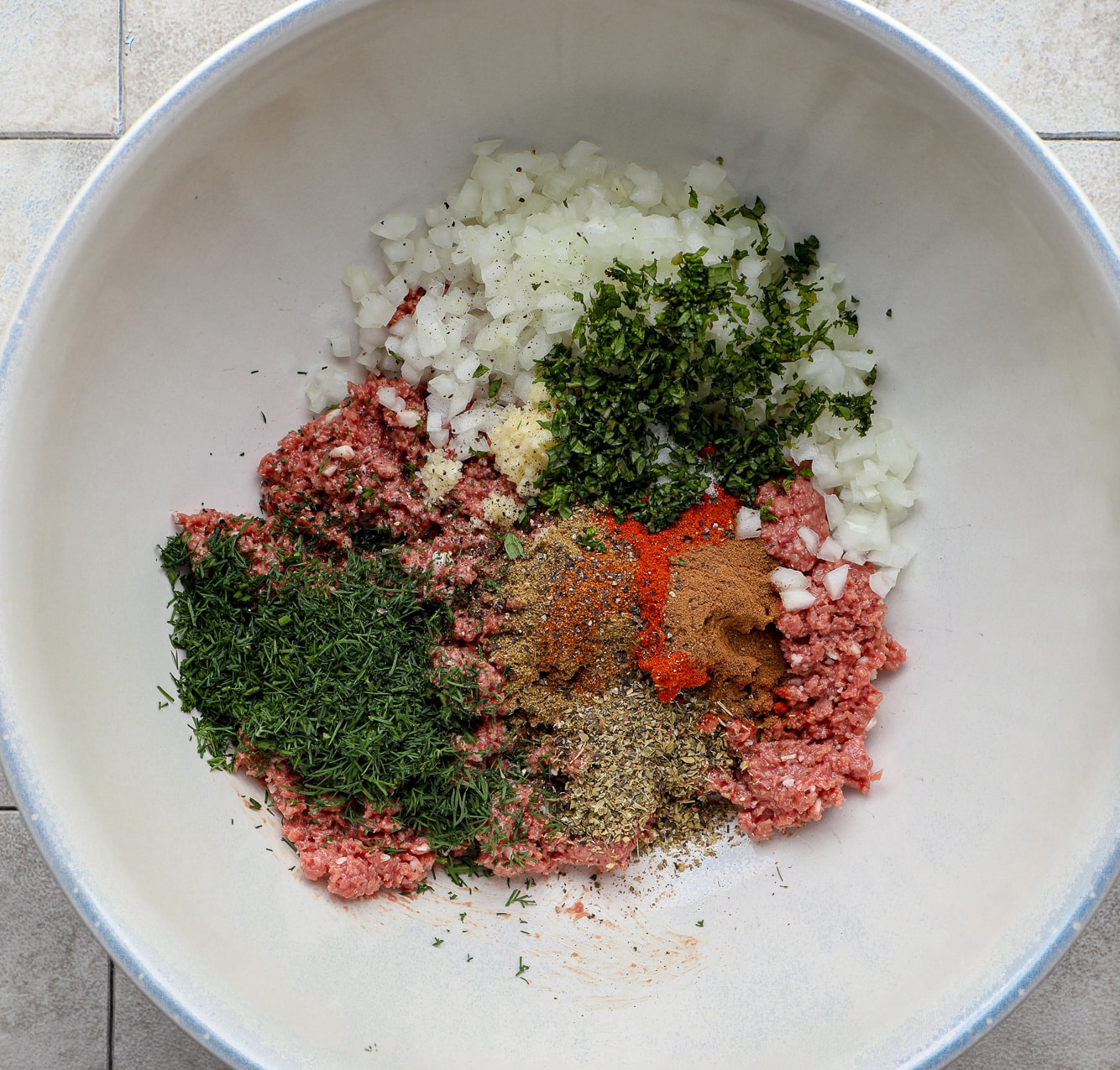 the ingredients for vegan kofta in a large white bowl.