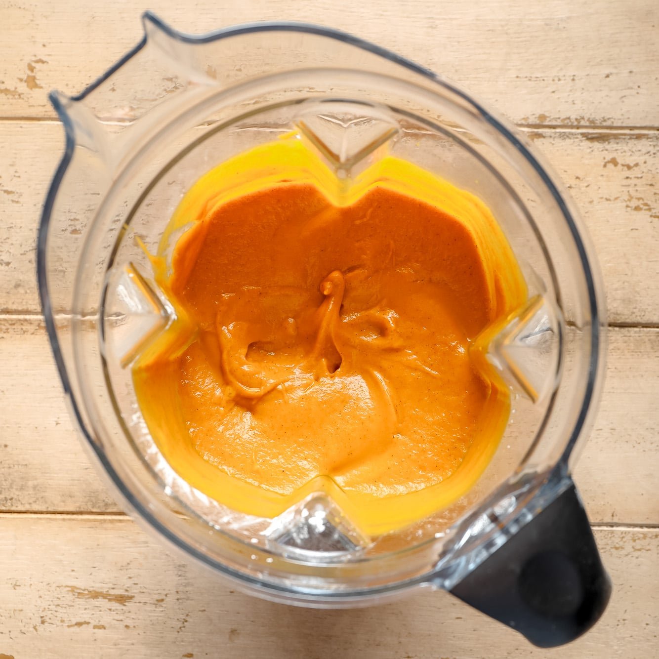 smooth, orange pumpkin pie filling in a blender.