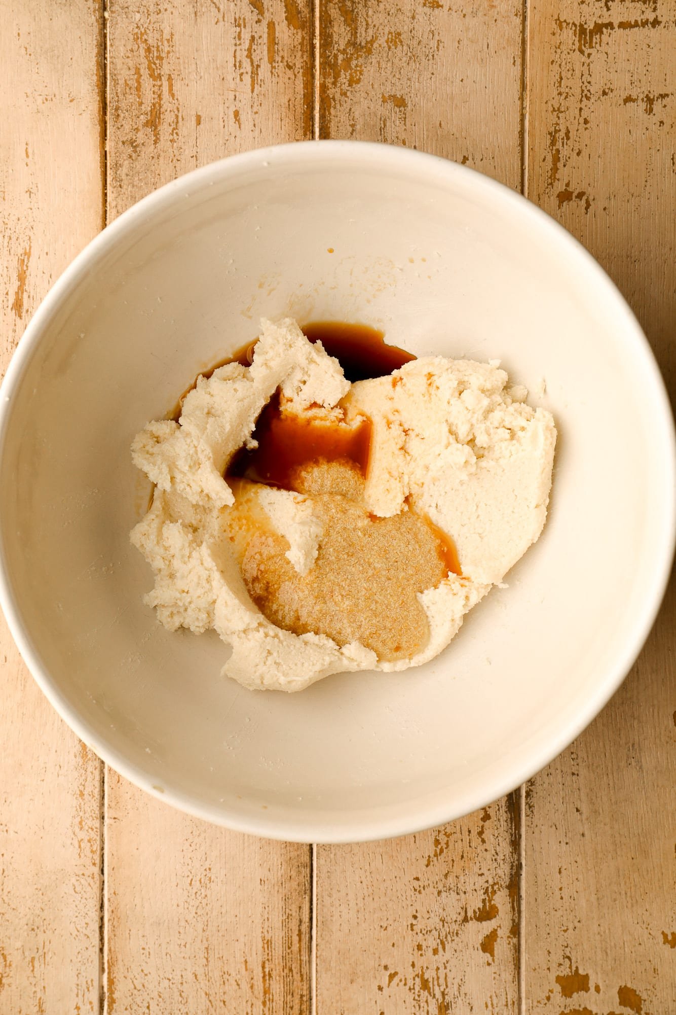 wet ingredients for vegan snickerdoodles in a white bowl.