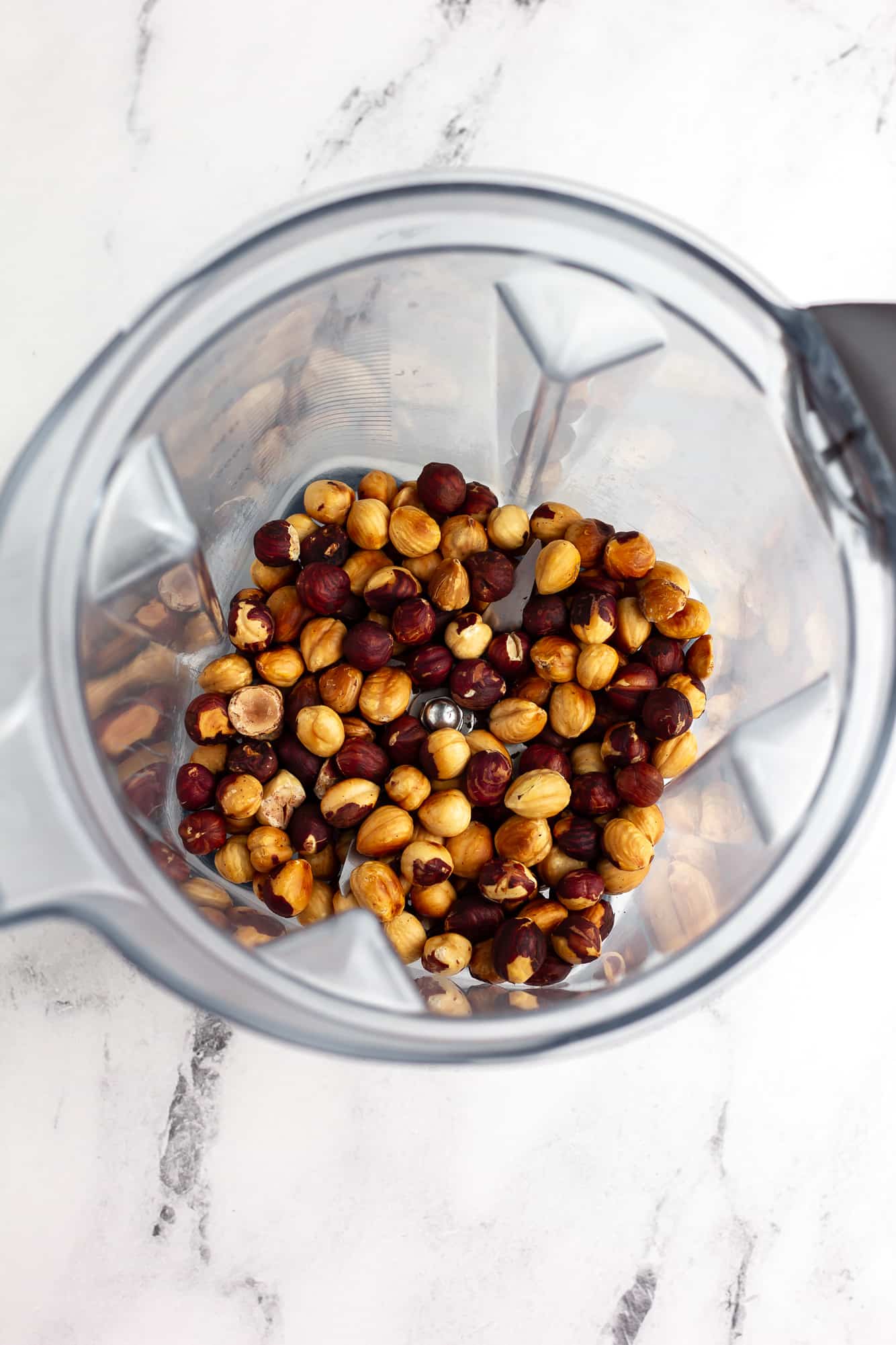 roasted hazelnuts in a blender.