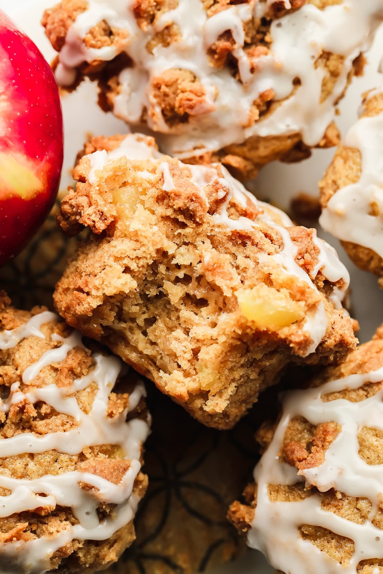 close up on a vegan apple muffin with a bite taken out of it.