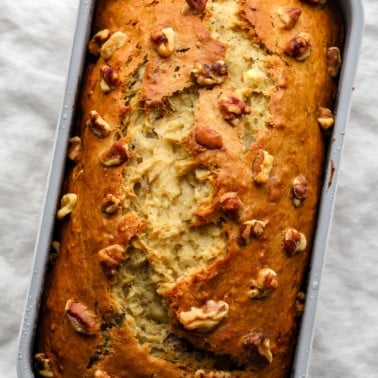 square image of top of banana bread with walnuts