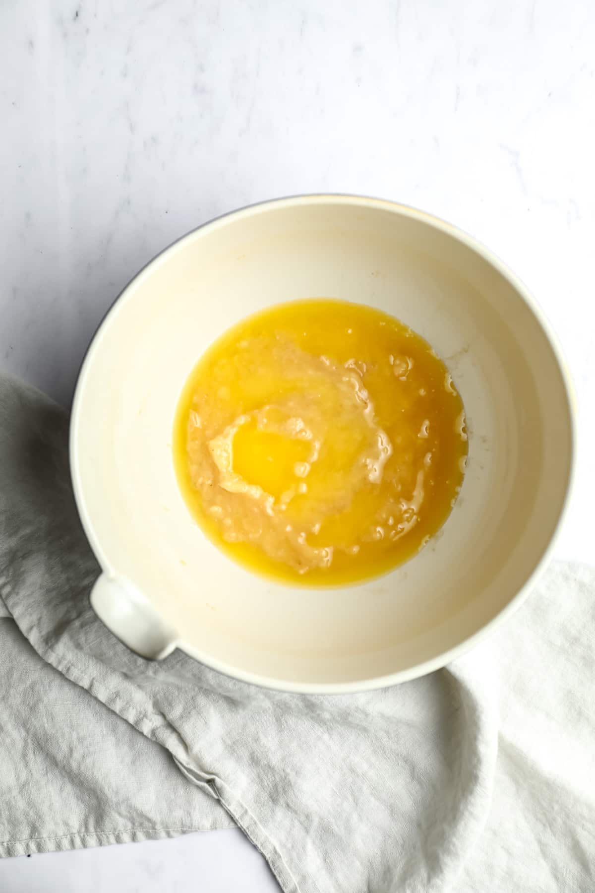 butter and mashed bananas in a bowl