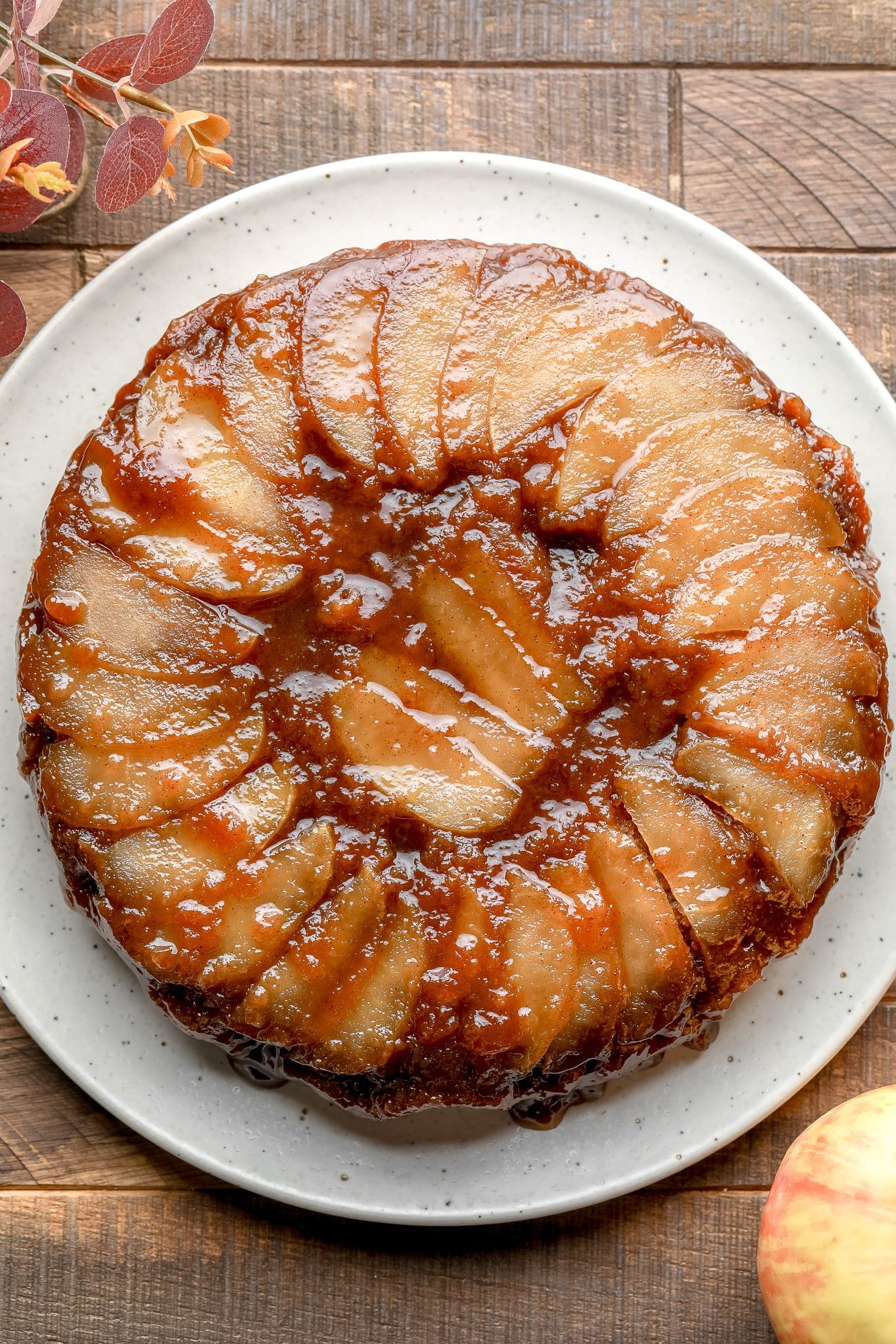 a baked Apple Upside Down Cake on a white plate.