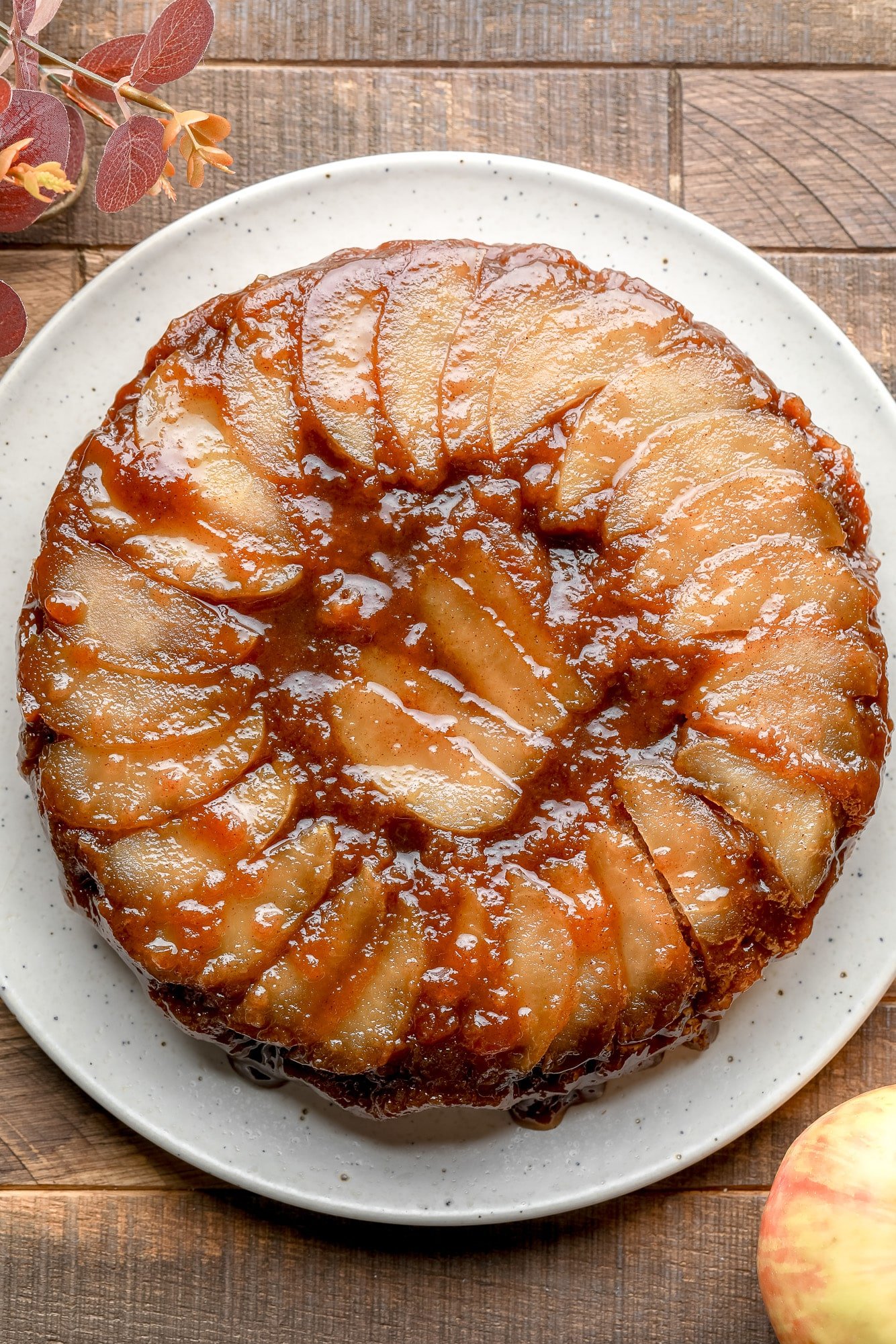 a baked Apple Upside Down Cake on a white plate.