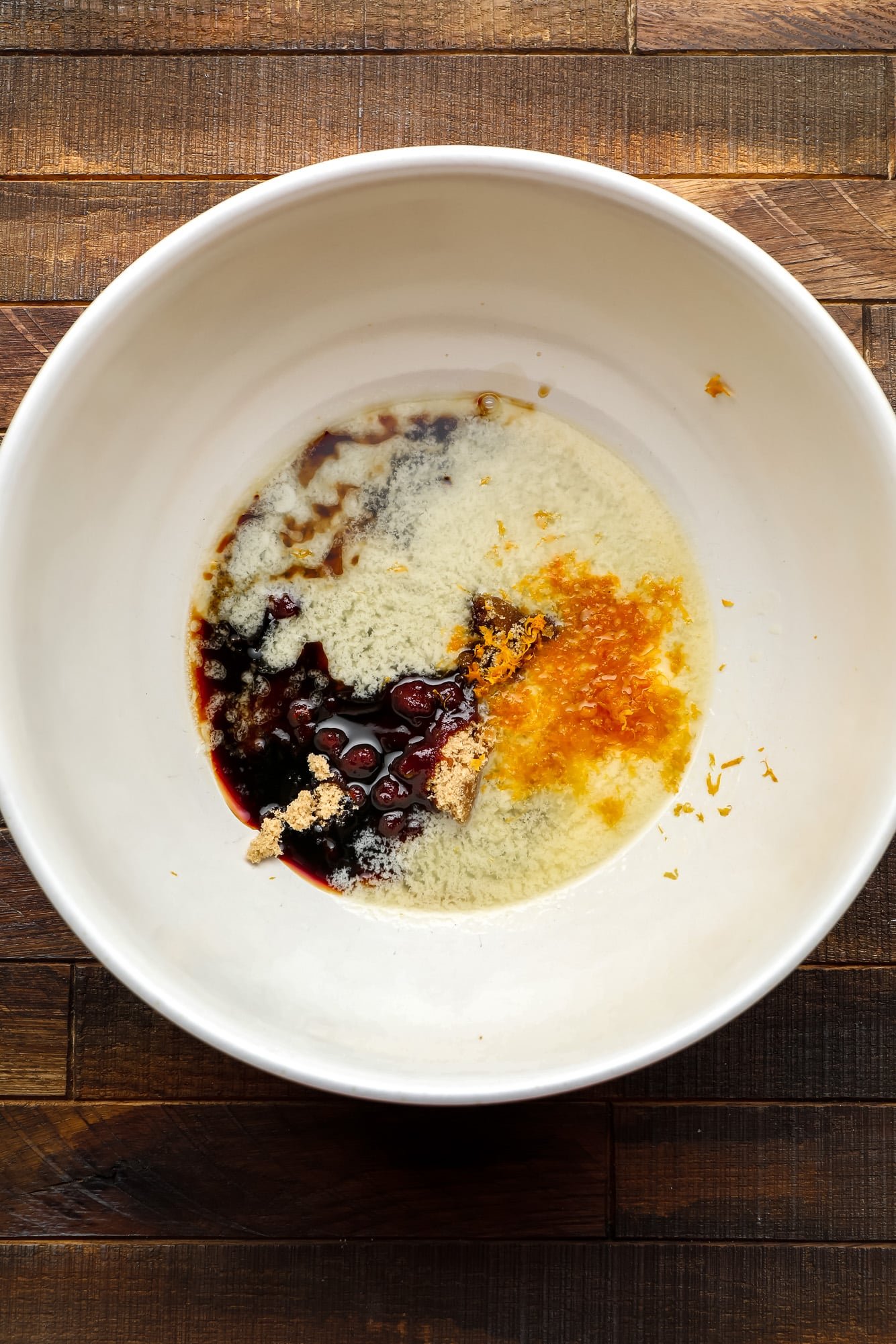 the wet ingredients for a Gingerbread Loaf in a large white bowl.