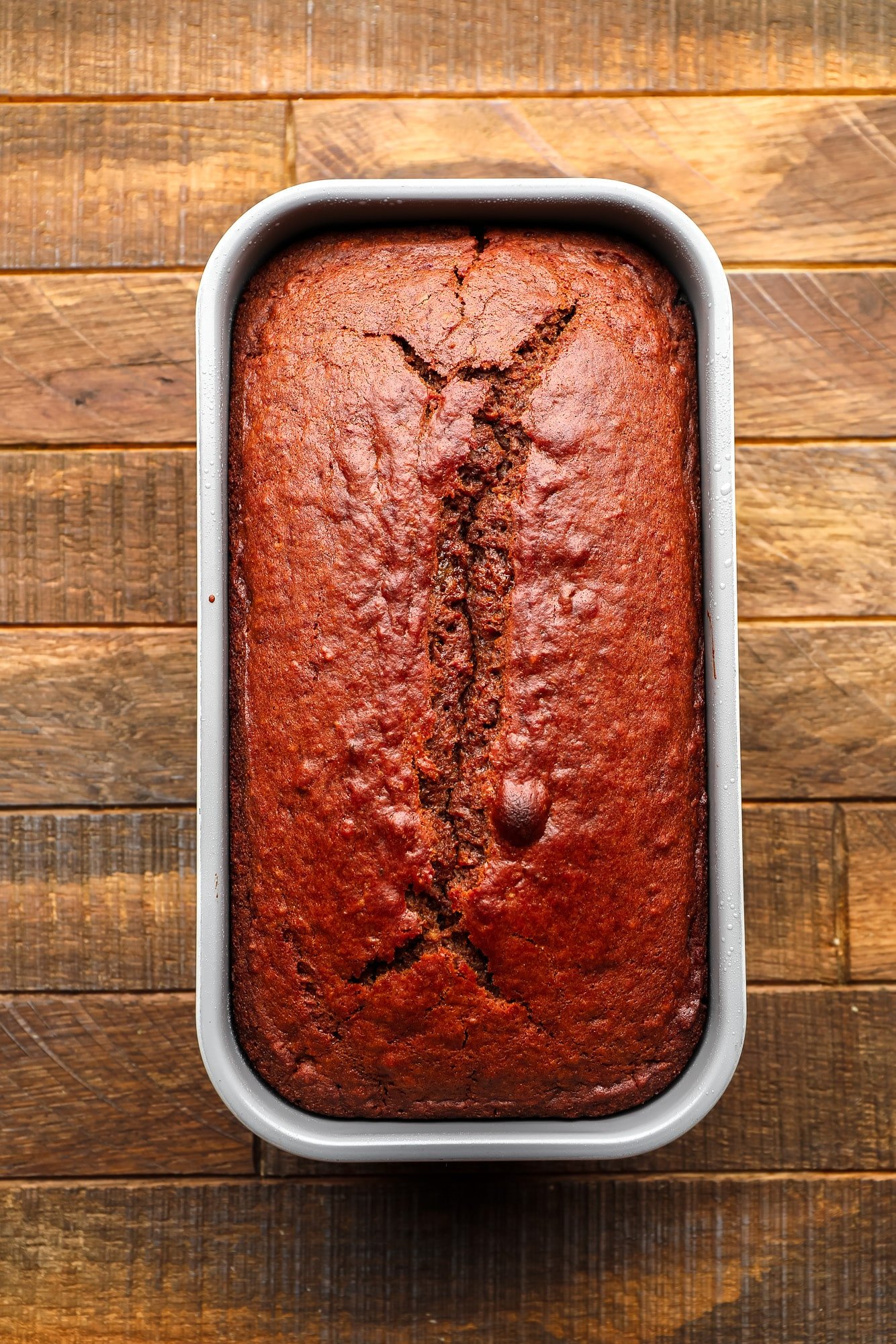 a baked gingerbread loaf in a loaf pan.