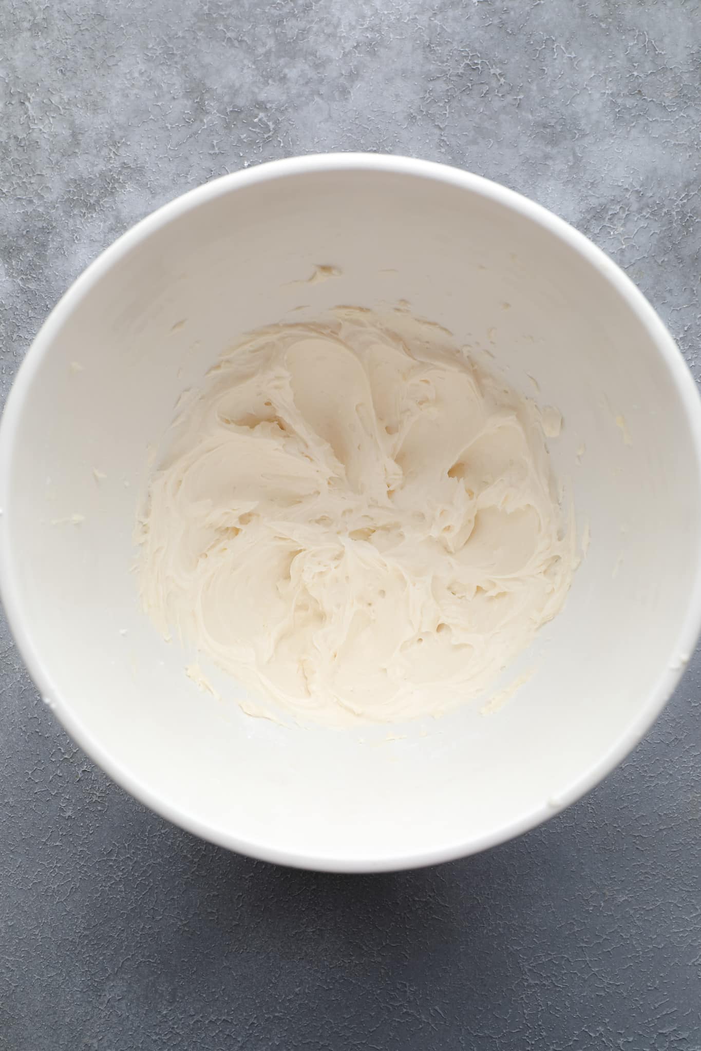 vegan vanilla frosting in a white bowl.