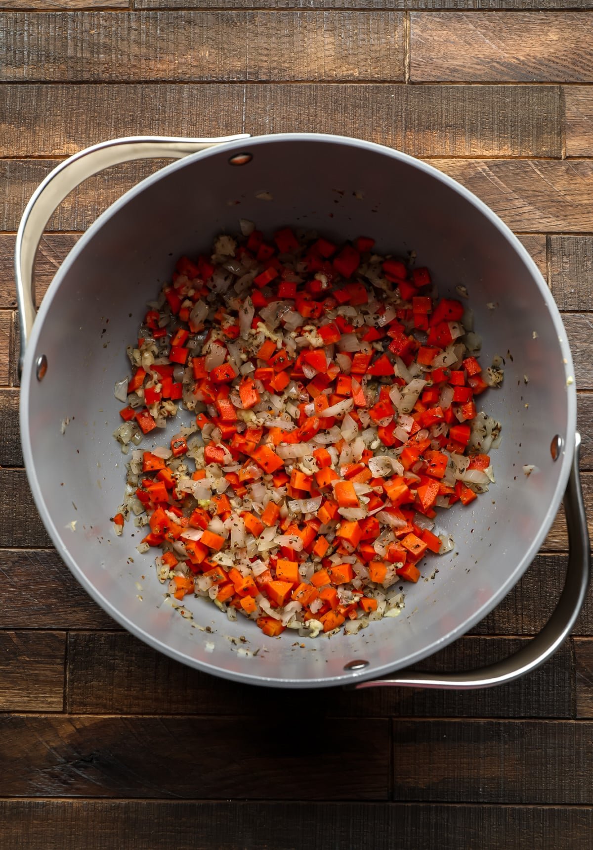 carrots and onions in a pot with spices