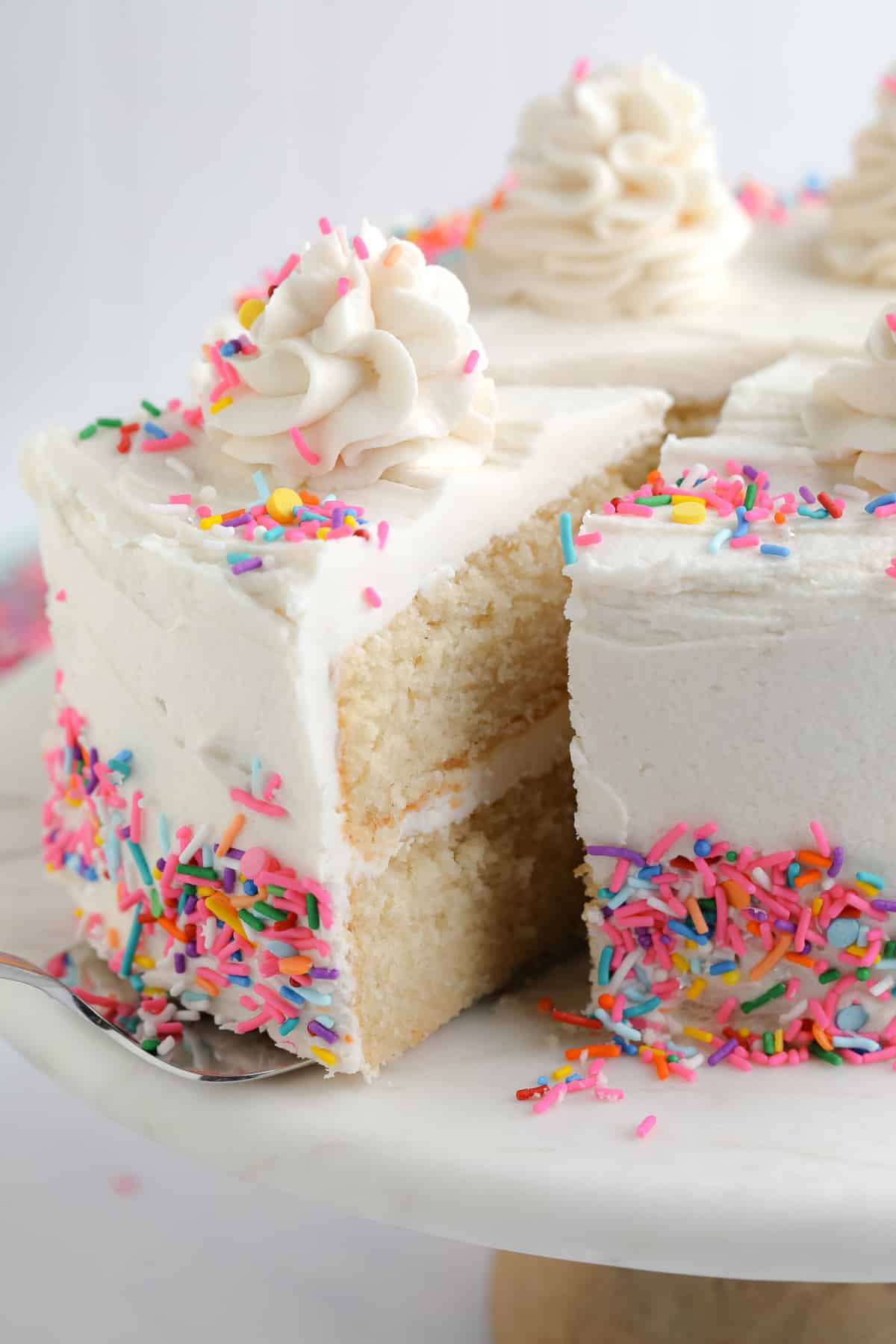 piece of cake being removed from cake platter