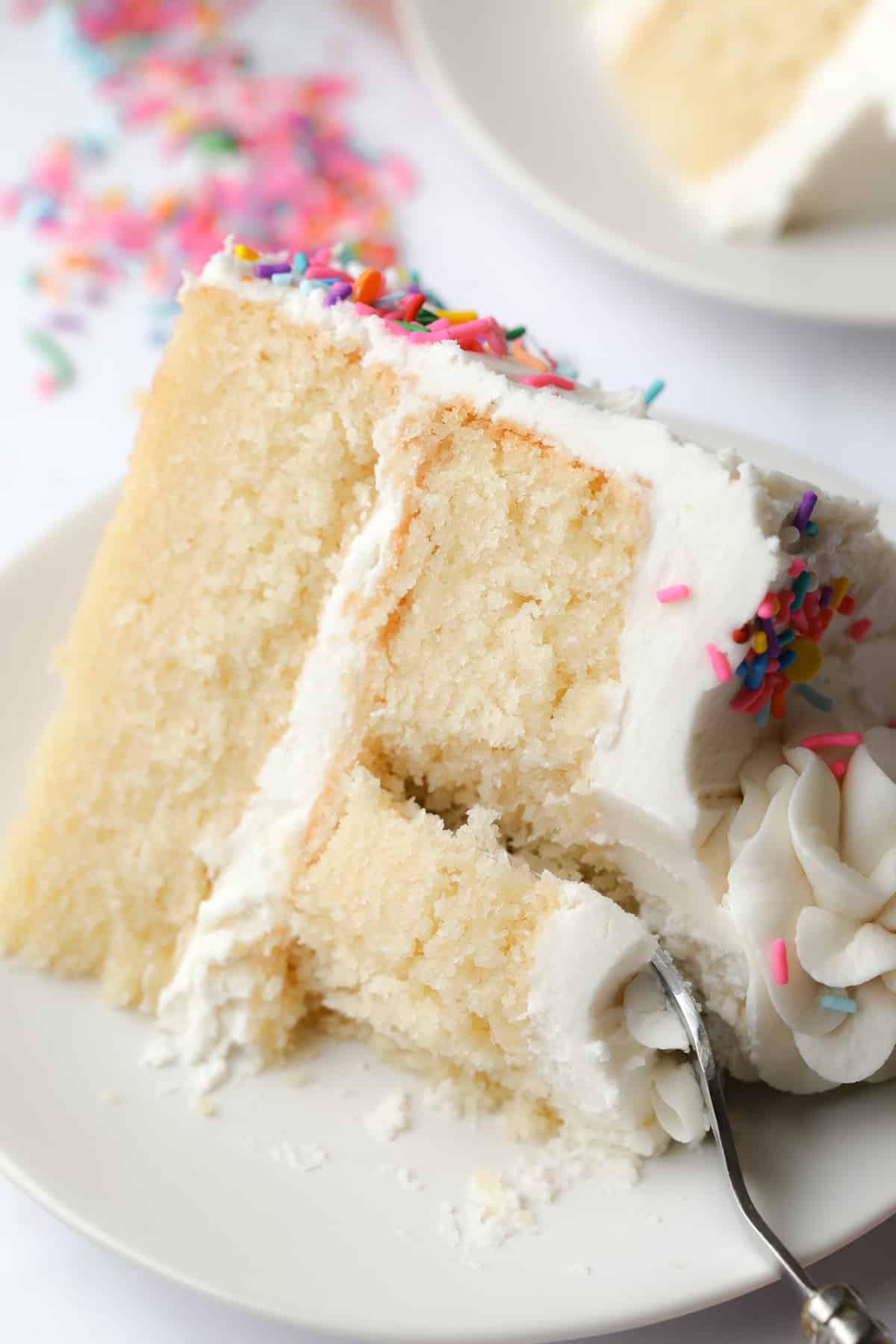 fork taking a piece of cake from the plate