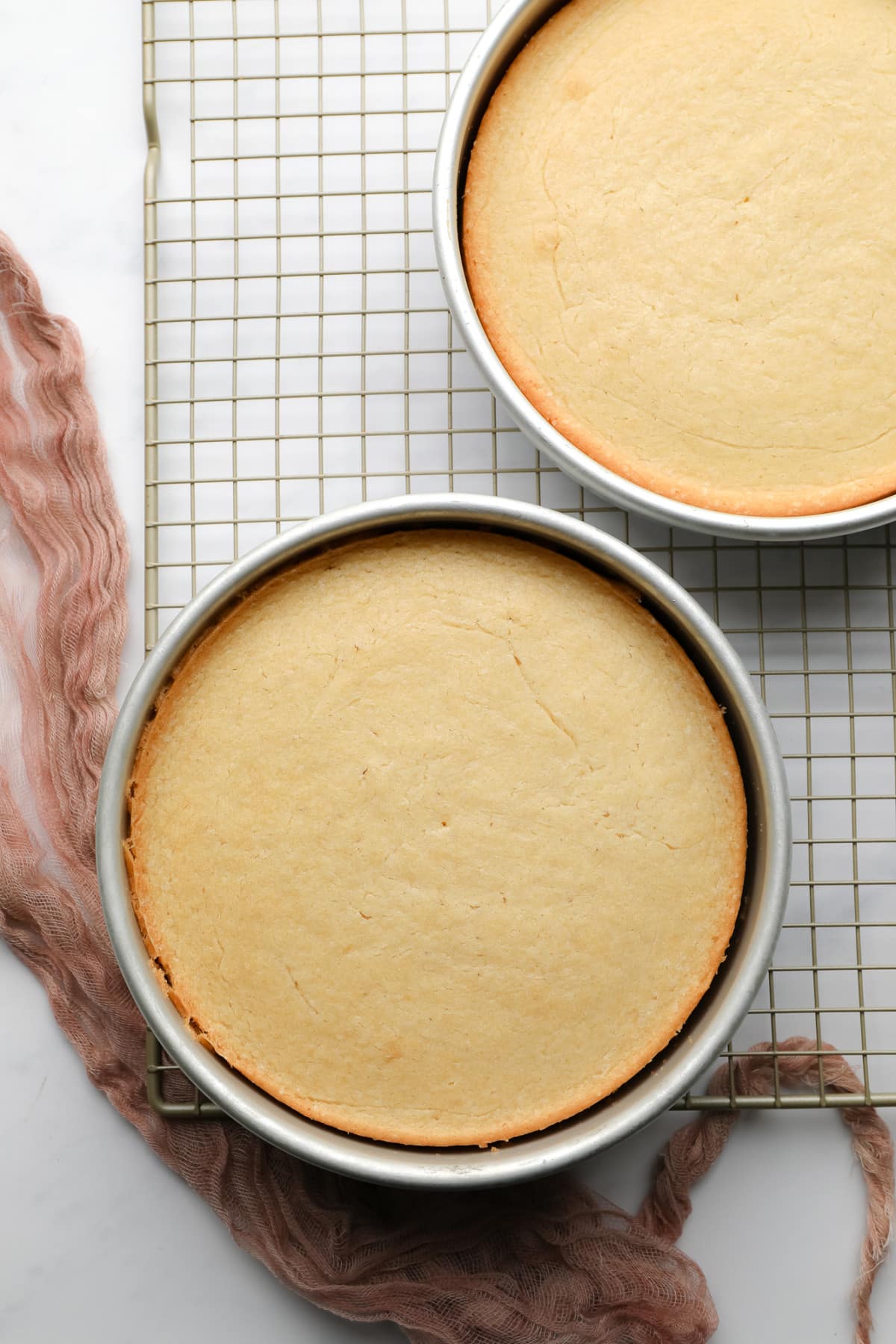 baked vegan vanilla cakes on a cooling rack