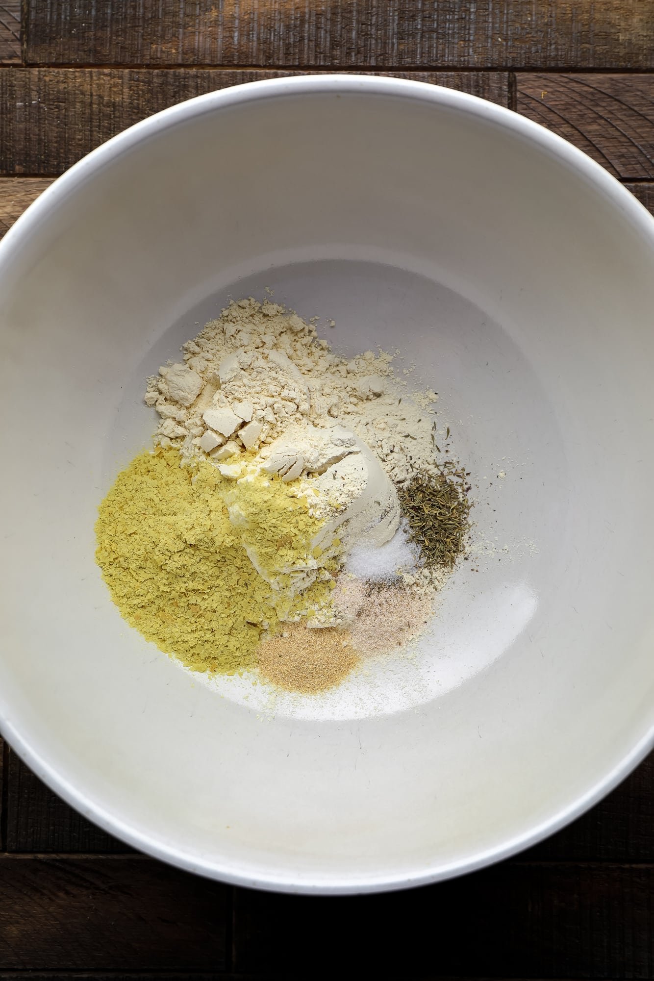 dry ingredients for seitan in a large white bowl.