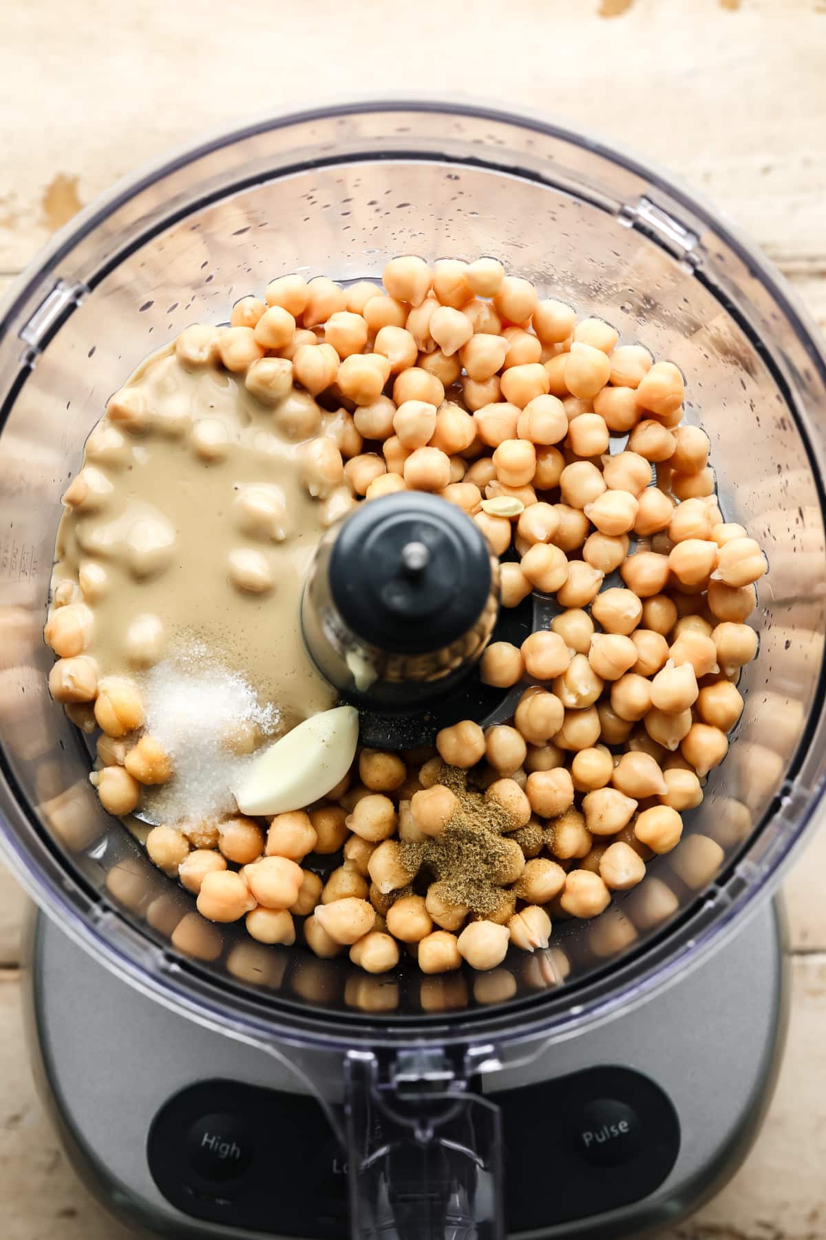 Ingredients for hummus in a food processor.