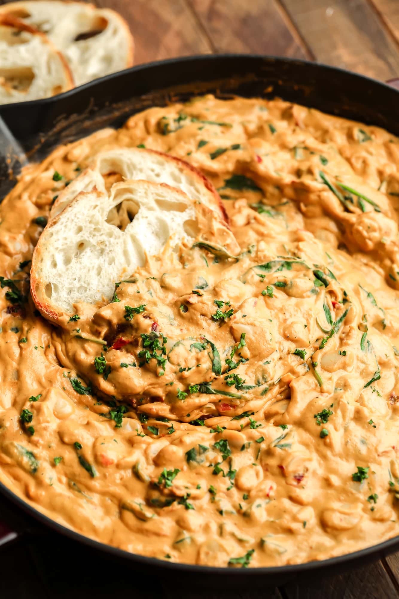 sliced bread dipped in a batch of creamy butter beans.