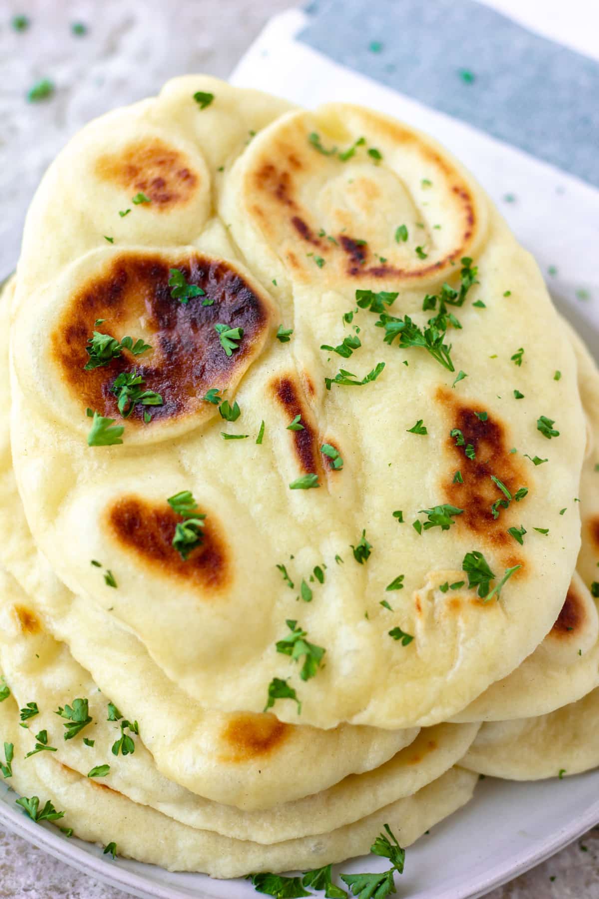 naan stacked on grey background