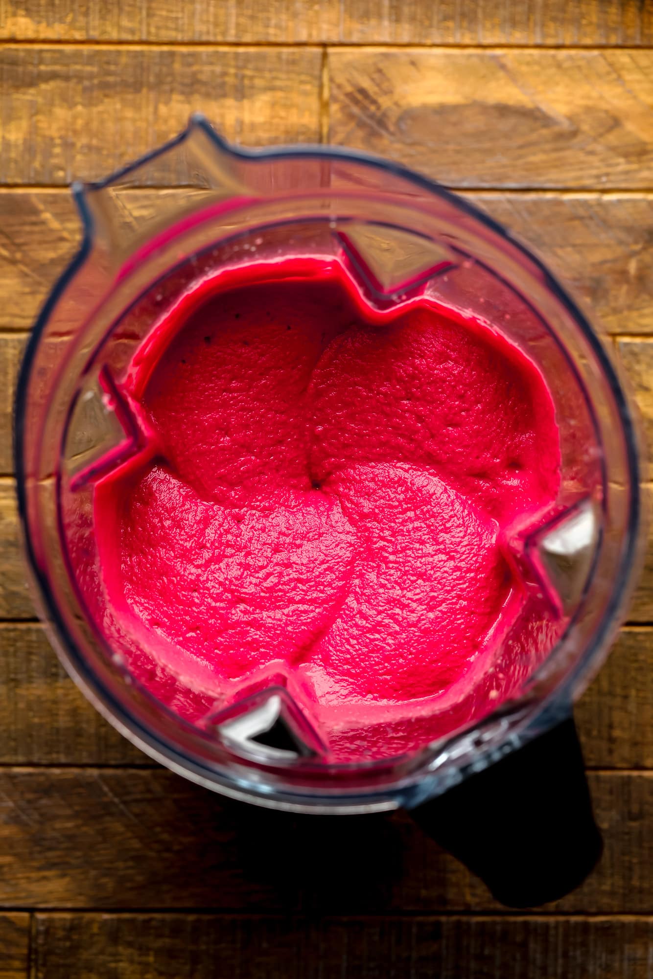pink beet hummus in a blender.