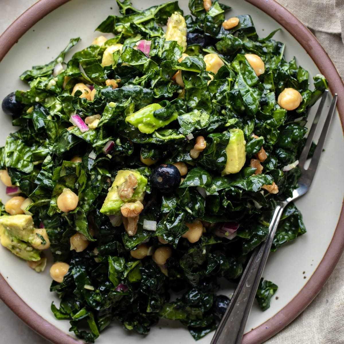close up on a kale salad on a plate.