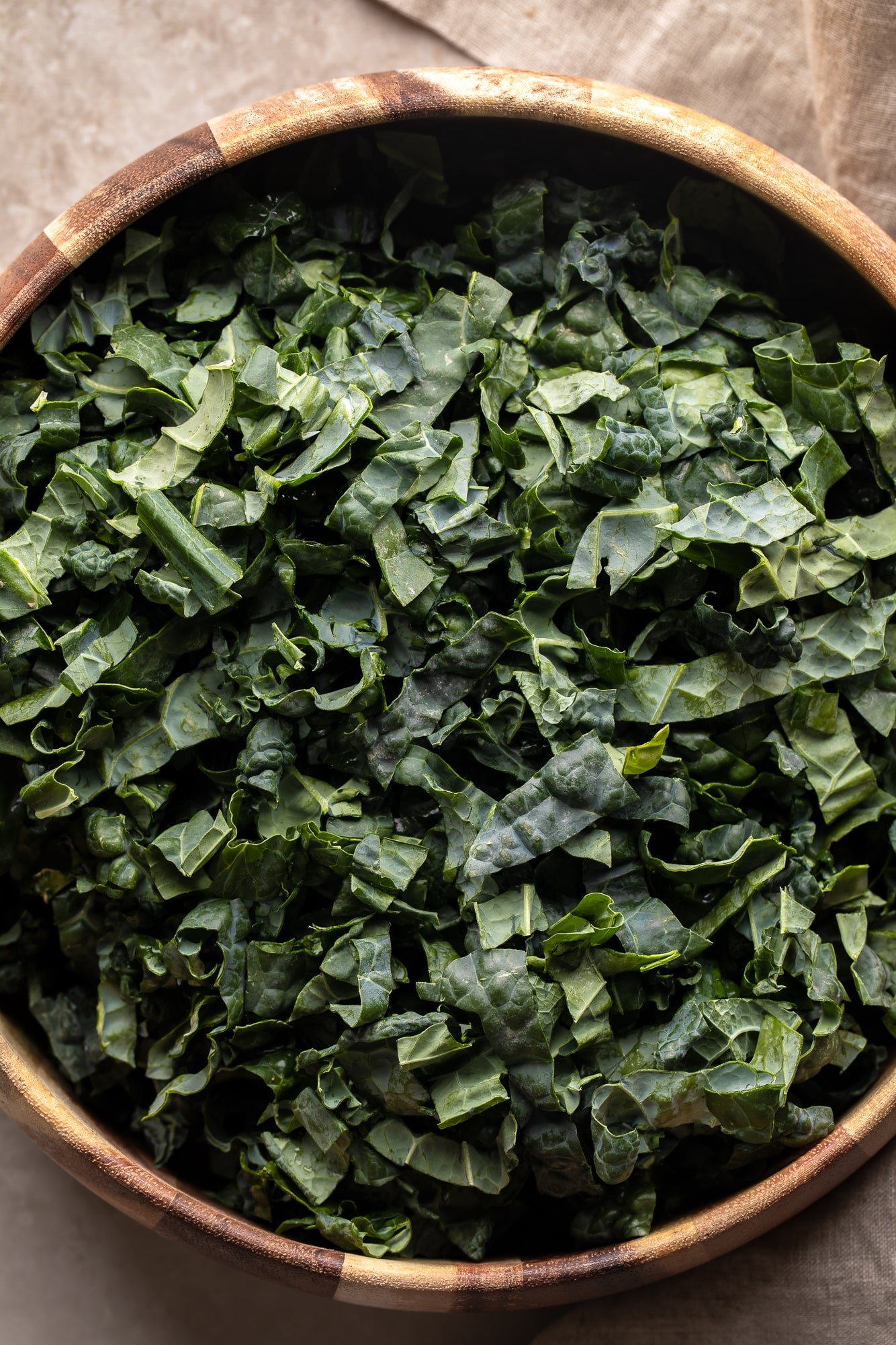 chopped kale in a large salad bowl.