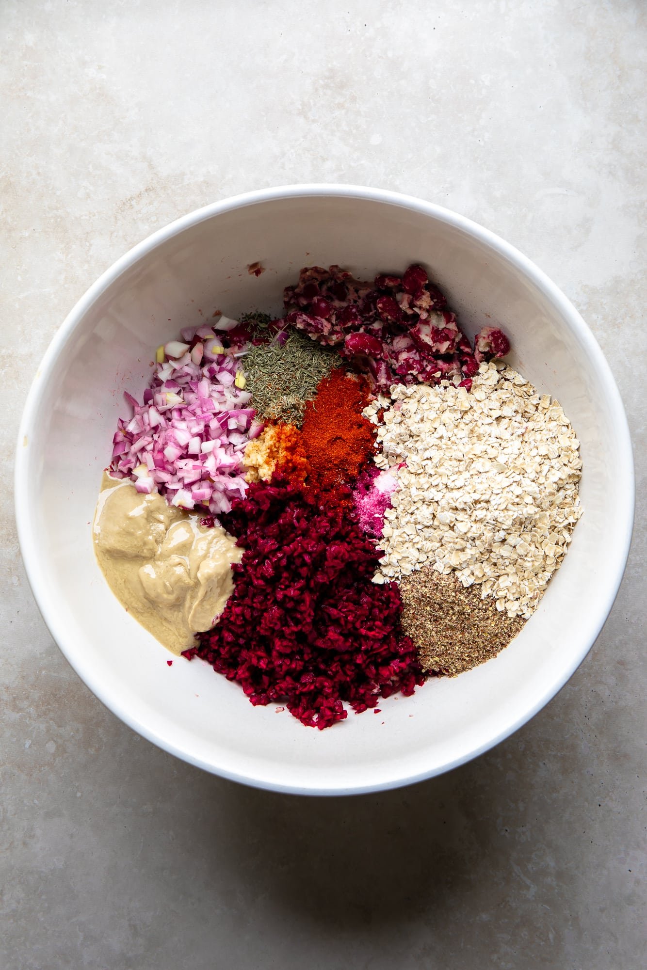 the ingredients for Kidney Beet Burgers together in a white bowl.