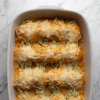 overhead view of baked vegan pumpkin stuffed shells in a casserole dish.