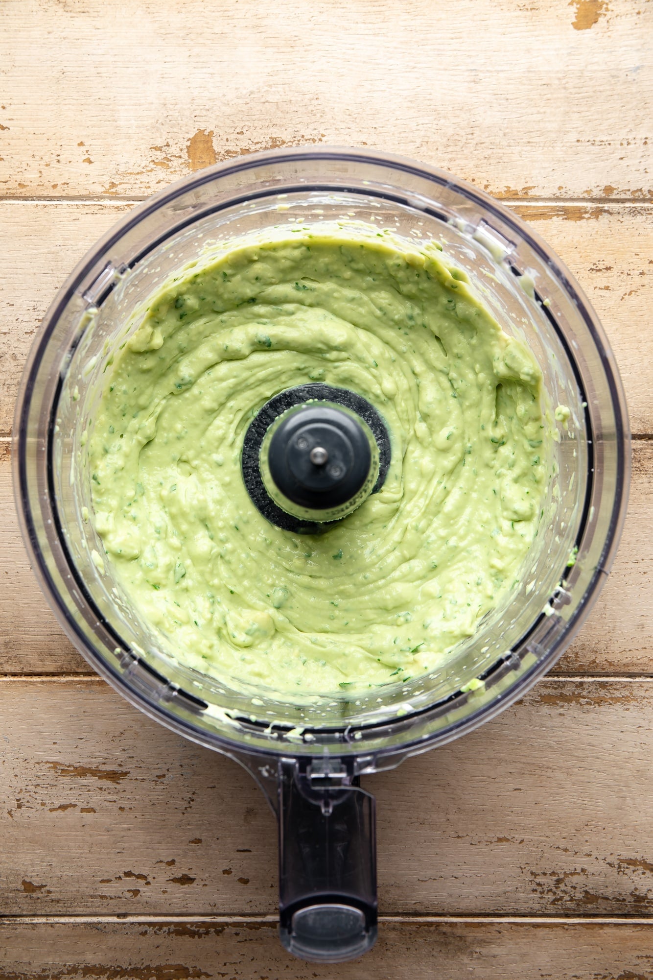 blended vegan avocado crema in a food processor.