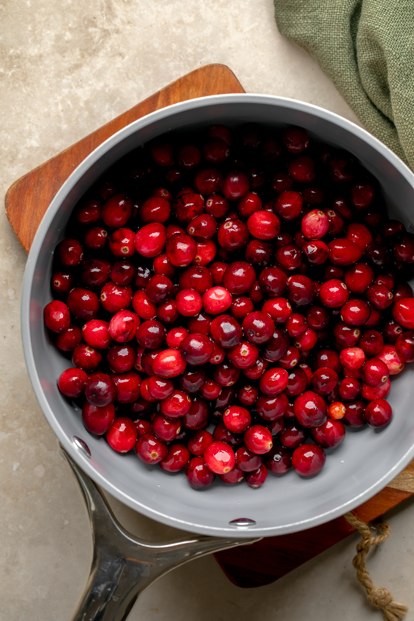 overhead view of fresh cranberries in a saucepan.