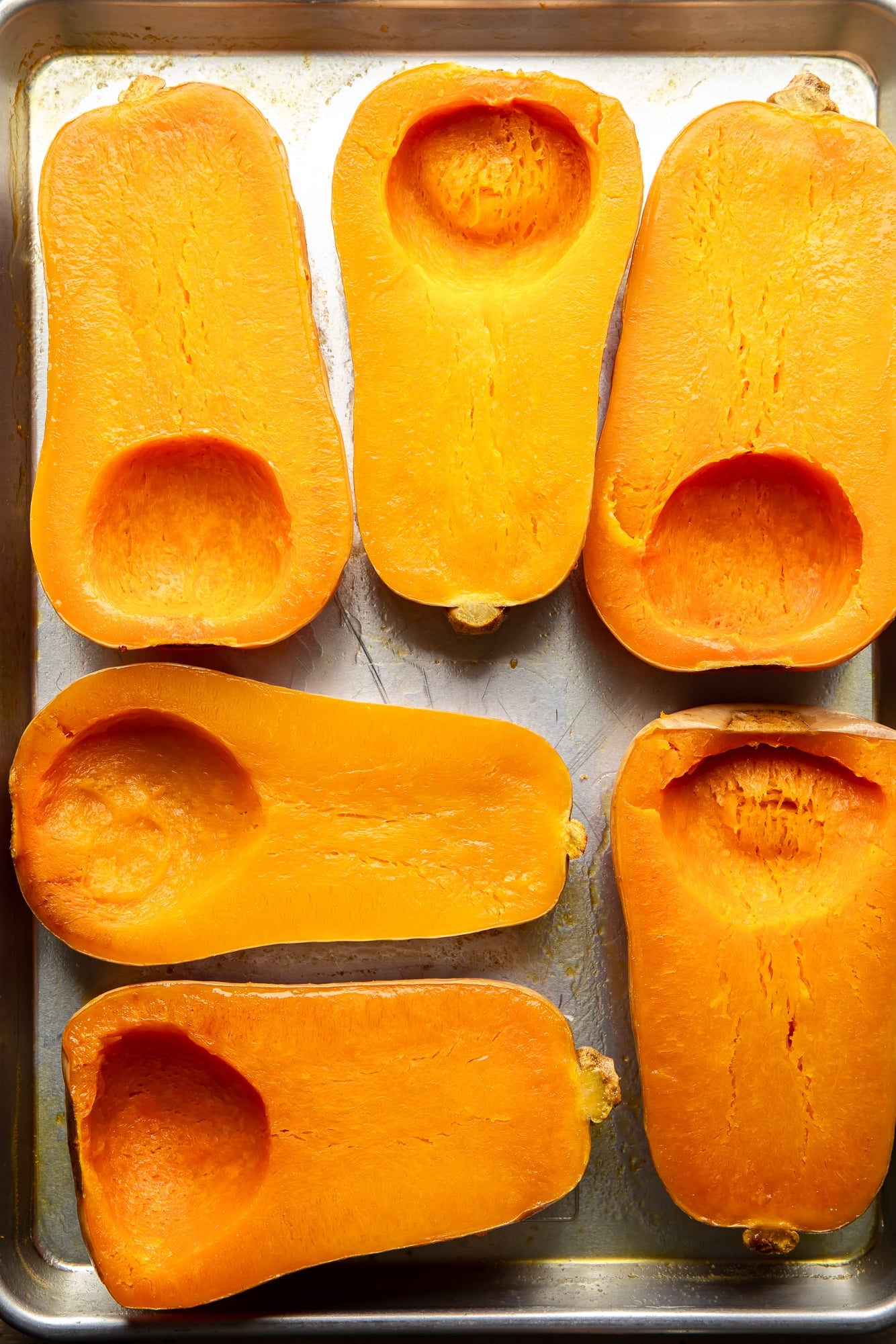 roasted butternut squashes on a baking sheet.