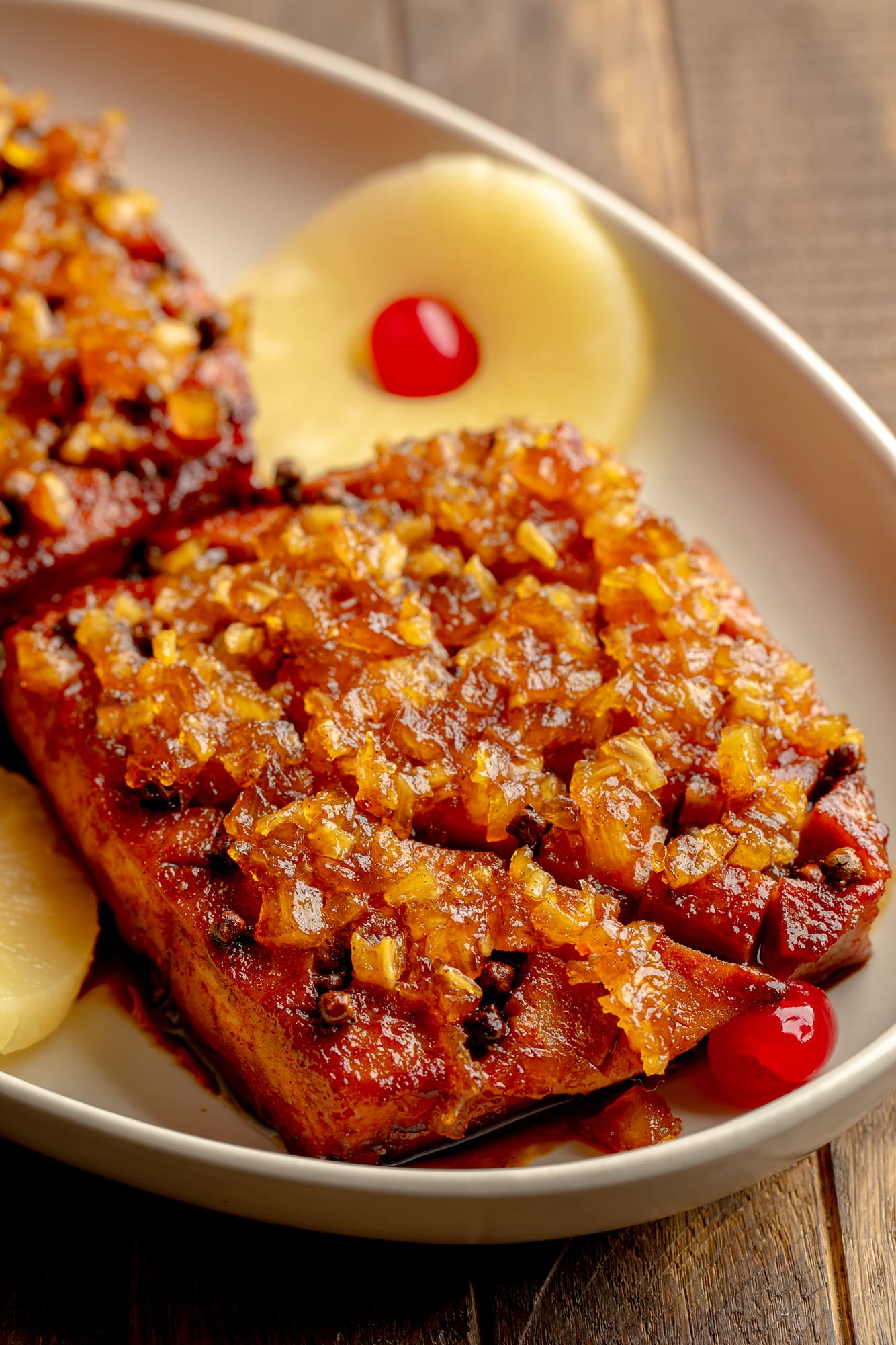 side view of a pineapple glazed tofu roast in a serving dish.