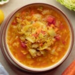 overhead view of a bowl of vegan cabbage soup.