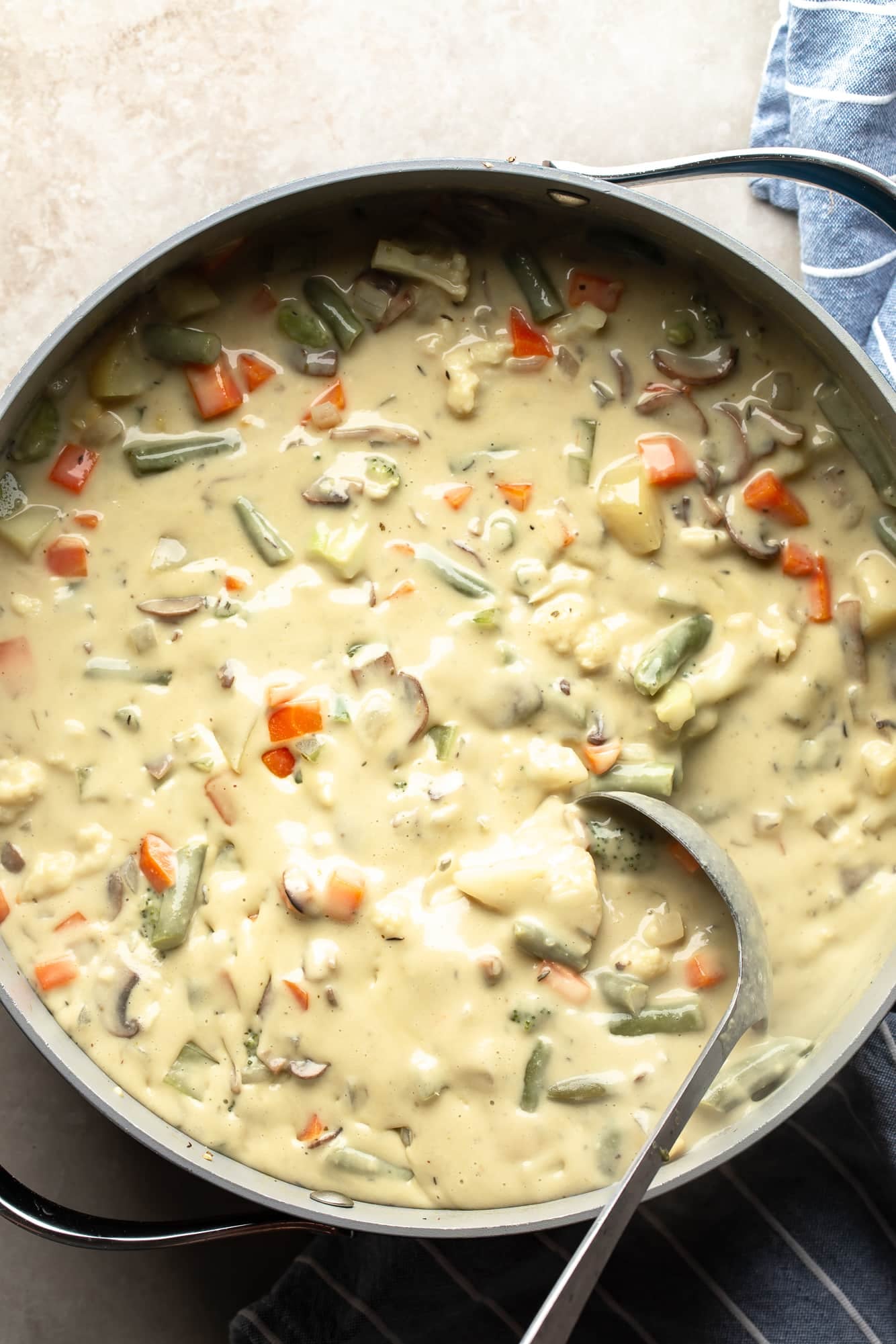 overhead view of Creamy Vegetable Soup in a large pot.