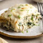 close up on a slice of vegan white lasagna on a plate.