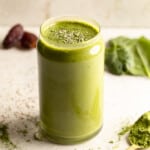 side view of a matcha smoothie in a glass.