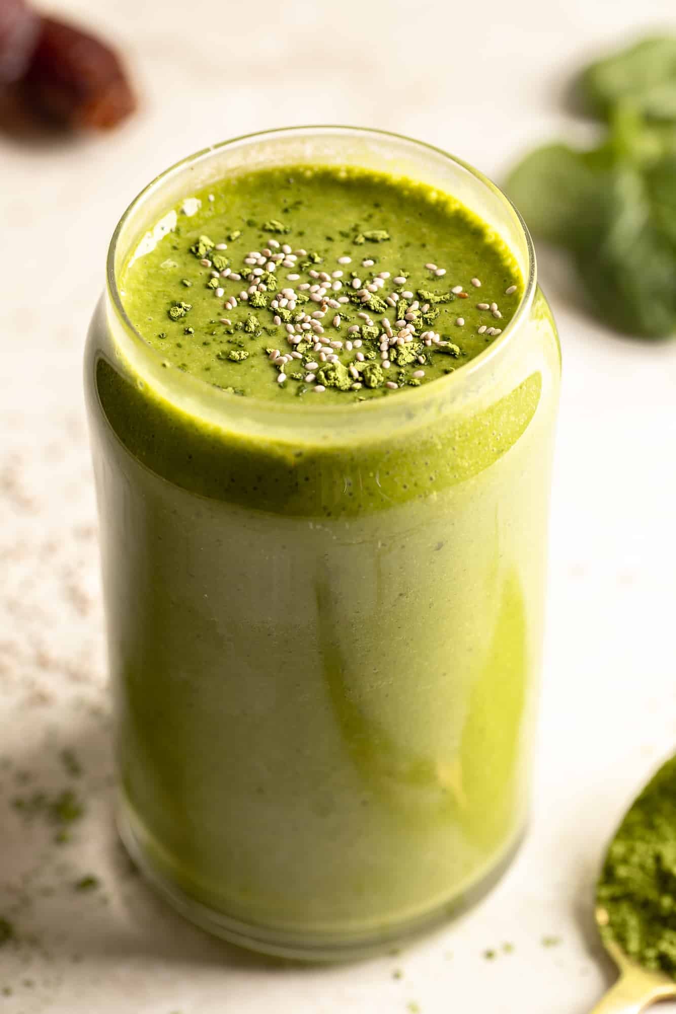 side view of a matcha smoothie in a glass.