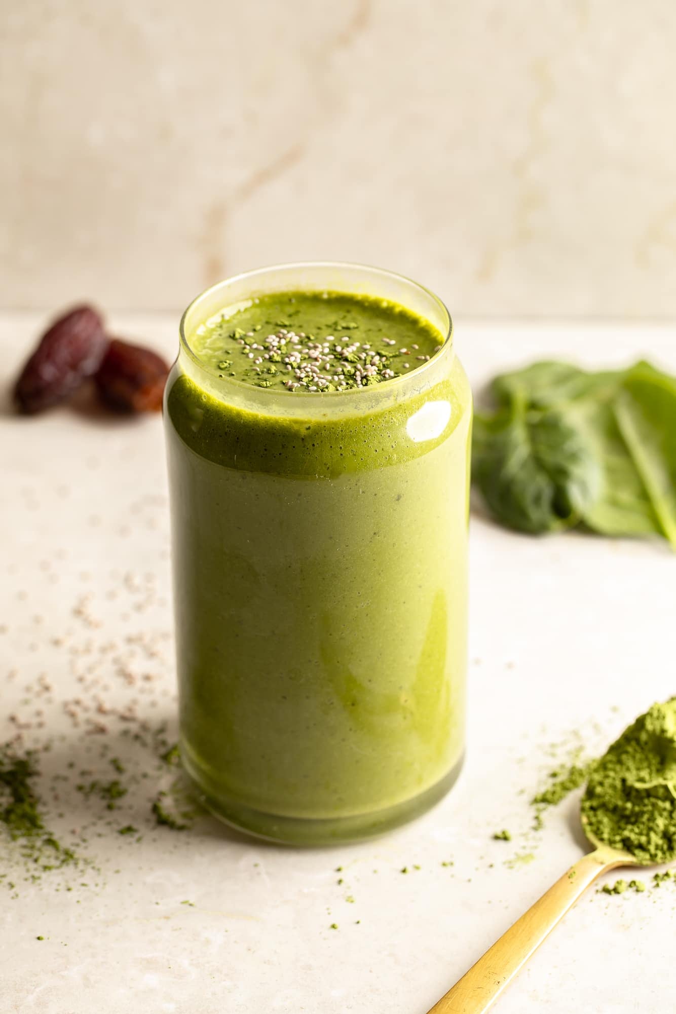 side view of a matcha smoothie in a glass.
