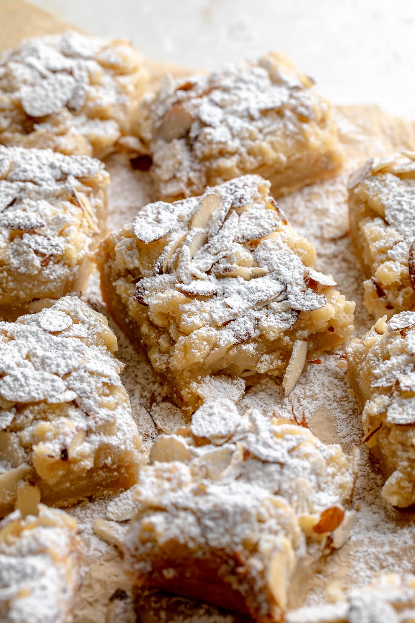 overhead view of vegan almond croissant bars topped with powdered sugar.