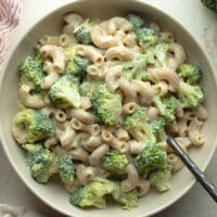 overhead view of vegan white mac and cheese with broccoli in a bowl.