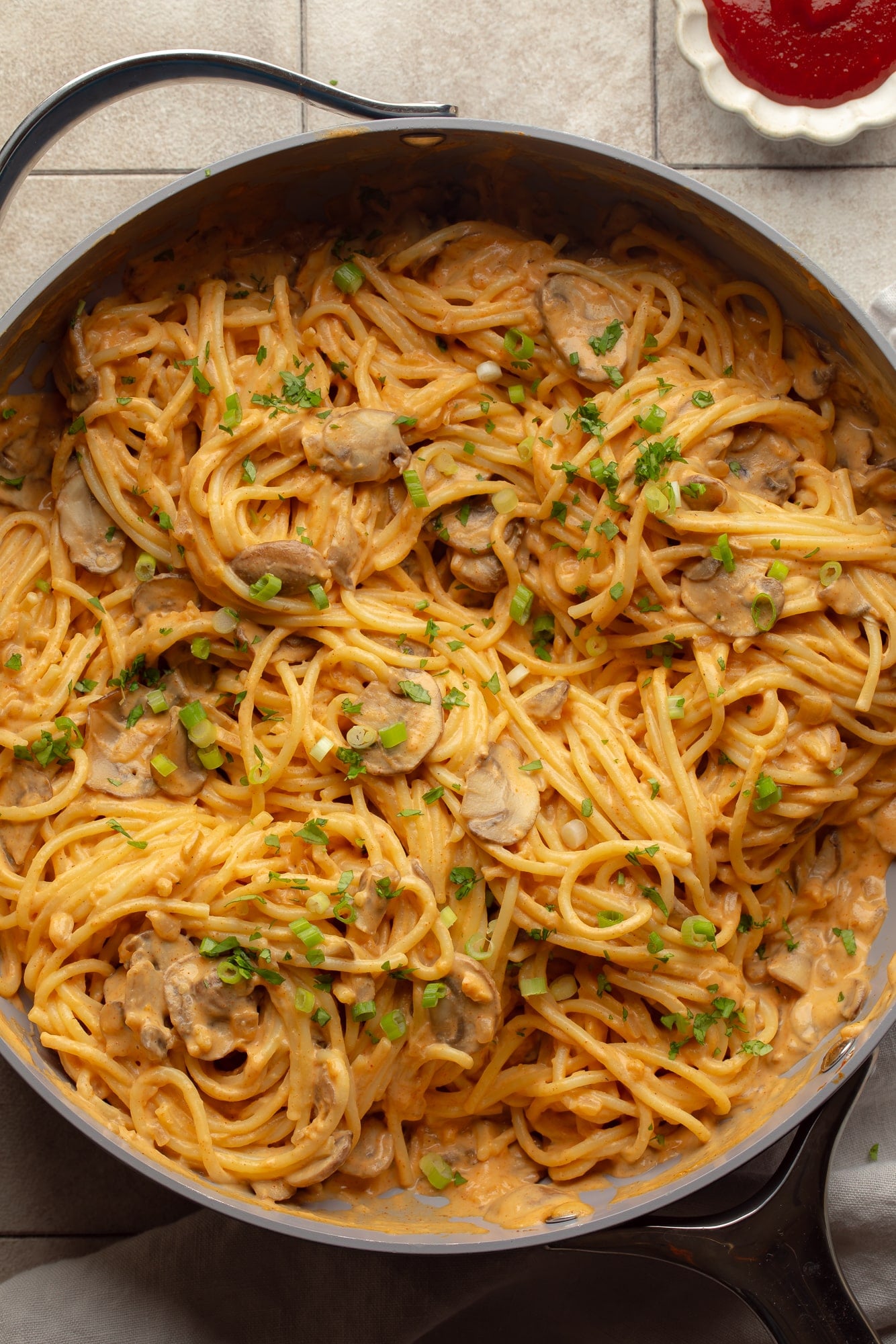 overhead view of a skillet full of creamy gochujang noodles.